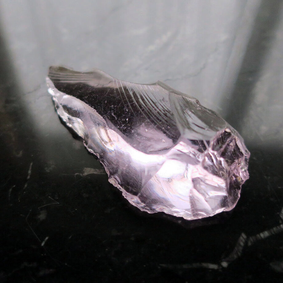 Pink crystal glass on black table